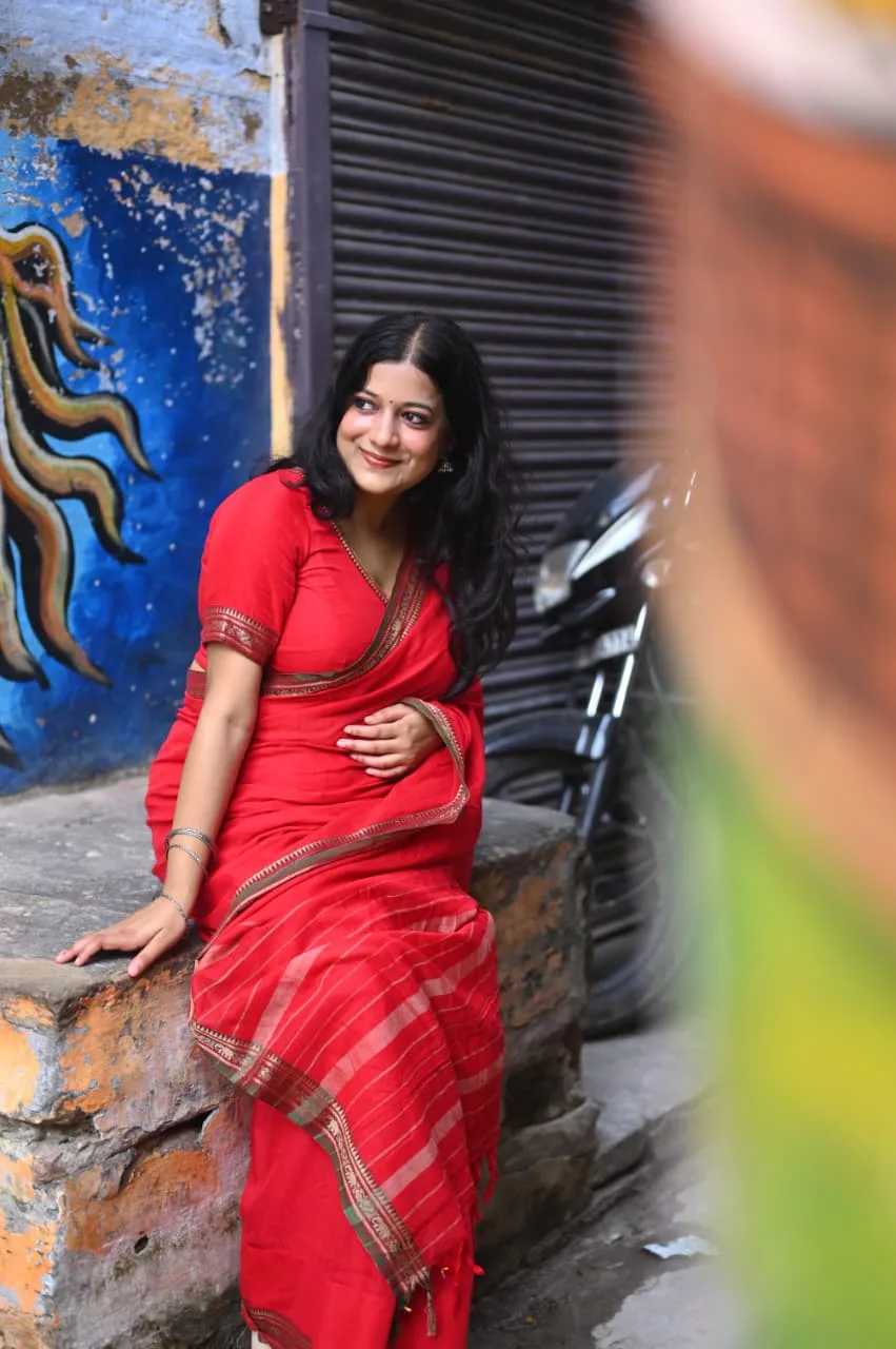 A visitor photographed in the last warm light of the day, photographed by One Moon Studio in Varanasi.